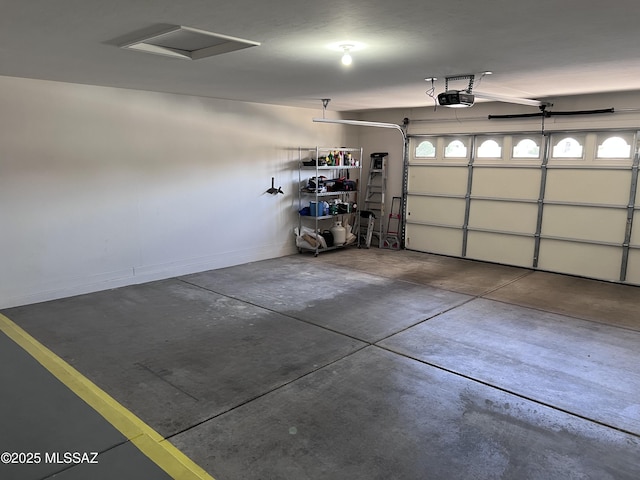 61867 E Ironwood Ln, Tucson, AZ 85739 - garage with baseboards and a garage door opener