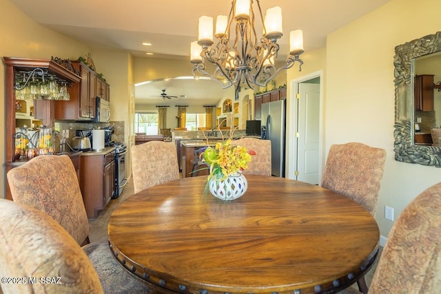 61867 E Ironwood Ln, Tucson, AZ 85739 - dining room with recessed lighting, arched walkways, and ceiling fan with notable chandelier