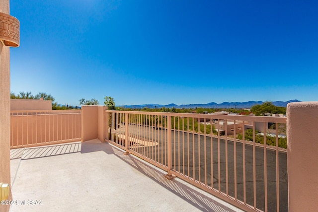 balcony featuring a mountain view