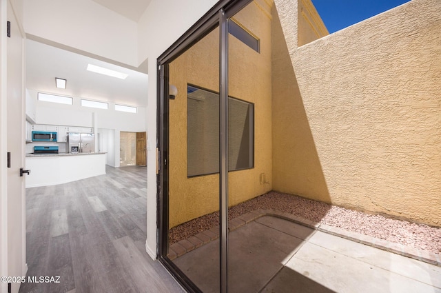 10127 E Achi, Tucson, AZ 85748 - hall with wood finished floors and a towering ceiling