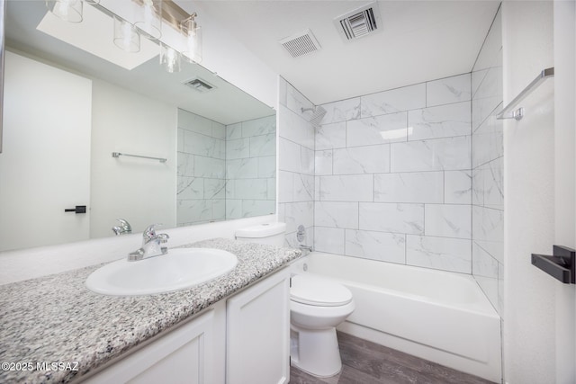 10127 E Achi, Tucson, AZ 85748 - full bathroom featuring toilet, wood finished floors, vanity, and bathtub / shower combination