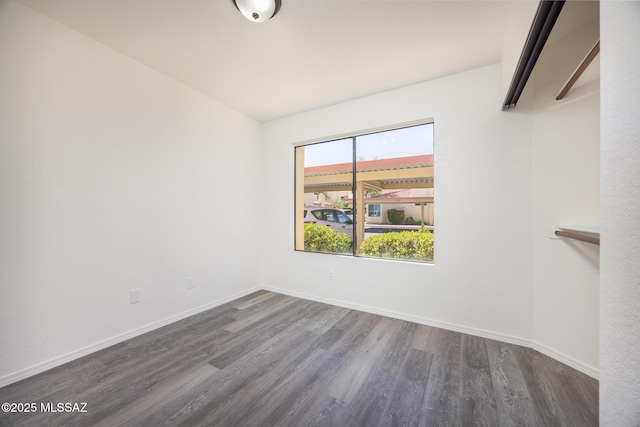 10127 E Achi, Tucson, AZ 85748 - unfurnished room featuring wood finished floors and baseboards