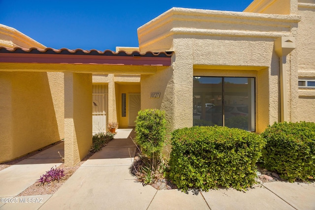 10127 E Achi, Tucson, AZ 85748 - property entrance featuring stucco siding