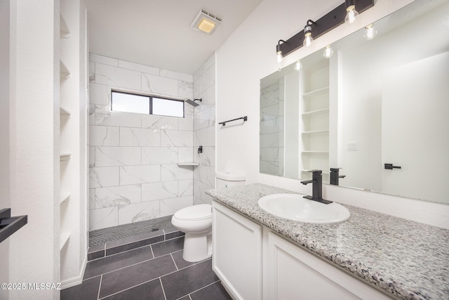 10127 E Achi, Tucson, AZ 85748 - full bathroom featuring tiled shower, toilet, vanity, and tile patterned floors