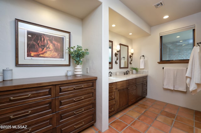 4915 N Via De La Granja, Tucson, AZ 85718 - full bath with double vanity, recessed lighting, and tile patterned floors