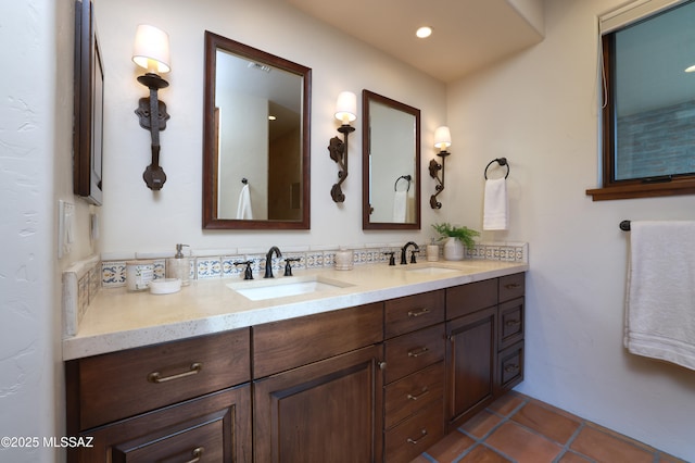 4915 N Via De La Granja, Tucson, AZ 85718 - bathroom featuring double vanity, tile patterned floors, and recessed lighting