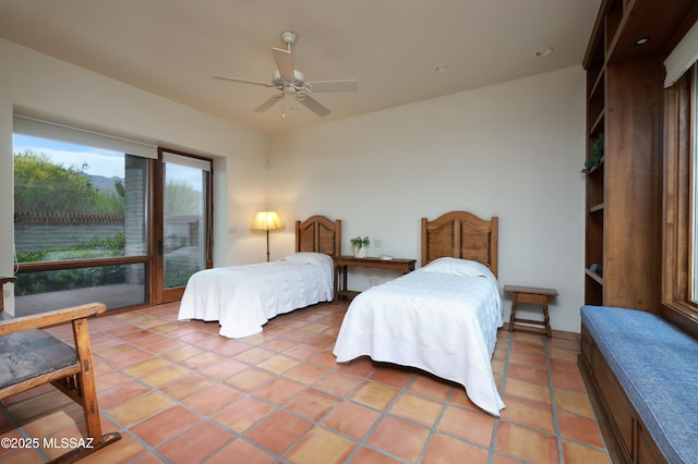 4915 N Via De La Granja, Tucson, AZ 85718 - bedroom with access to outside, light tile patterned floors, and ceiling fan