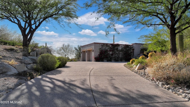 4915 N Via De La Granja, Tucson, AZ 85718 - view of front of house featuring concrete driveway and an attached garage