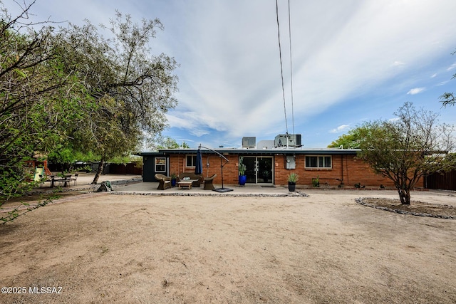 1652 W Roller Coaster Rd, Tucson, AZ 85704 - back of house with fence, a patio area, and central air condition unit