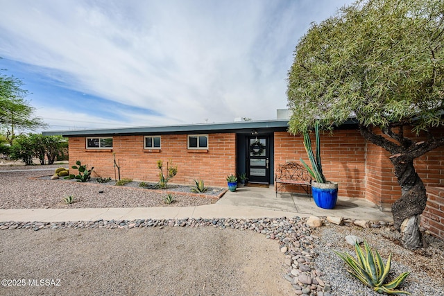 1652 W Roller Coaster Rd, Tucson, AZ 85704 - single story home featuring brick siding