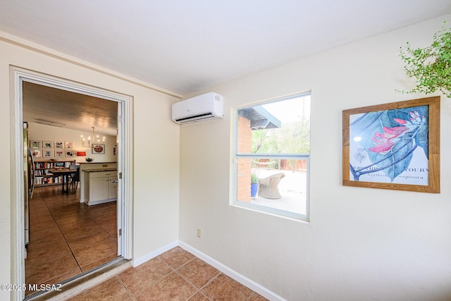 1652 W Roller Coaster Rd, Tucson, AZ 85704 - unfurnished dining area featuring light tile patterned flooring, a wall mounted air conditioner, baseboards, and a notable chandelier