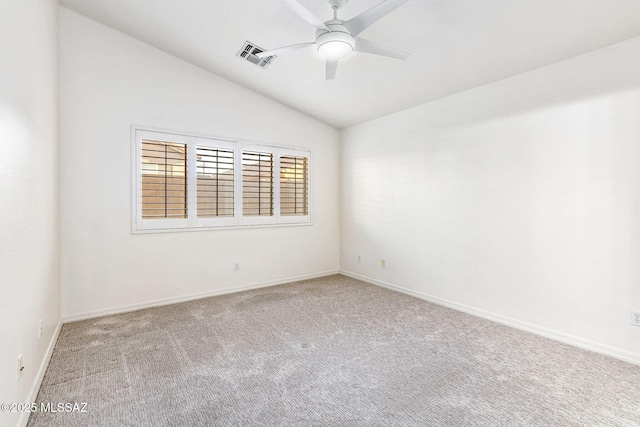 unfurnished room featuring lofted ceiling, visible vents, ceiling fan, carpet floors, and baseboards