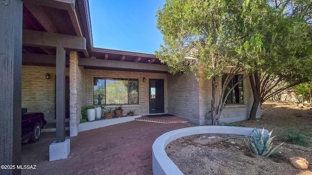 4913 N Via Serenidad, Tucson, AZ 85718 - entrance to property with brick siding