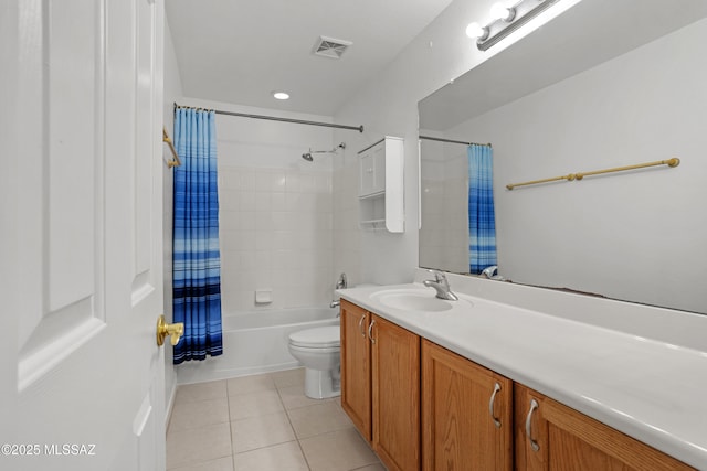 bathroom featuring visible vents, toilet, shower / bath combo with shower curtain, vanity, and tile patterned floors