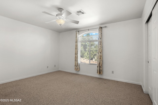 unfurnished bedroom featuring visible vents, baseboards, a closet, and carpet