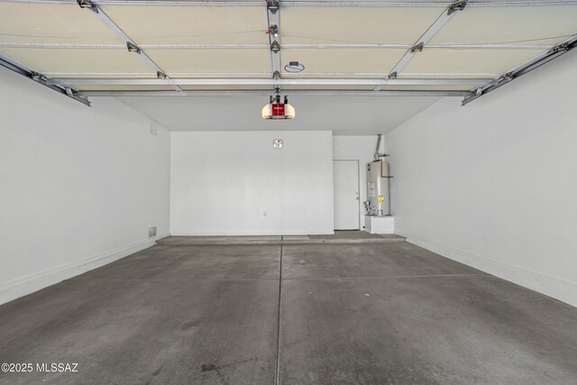 garage featuring a garage door opener and water heater
