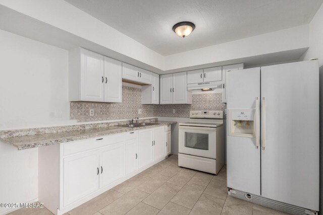 5850 S Del Moral Blvd, Tucson, AZ 85706 - kitchen featuring white appliances, under cabinet range hood, a sink, and light countertops