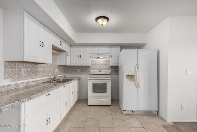kitchen with decorative backsplash, a sink, white cabinets, under cabinet range hood, and white appliances