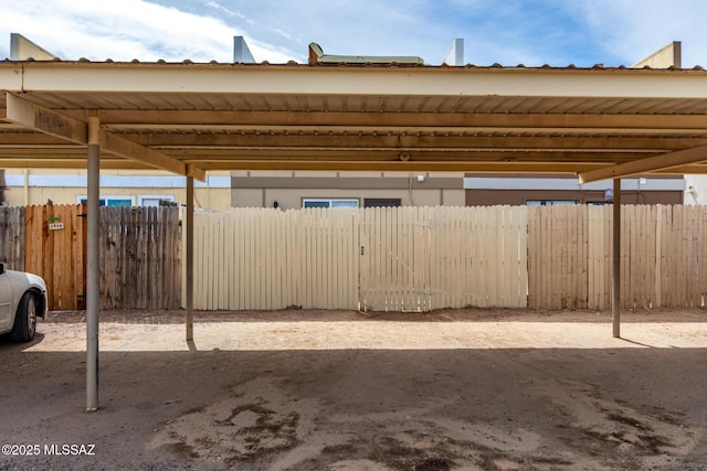 covered parking lot with fence