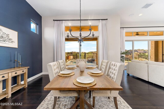 dining room with wood finished floors, an inviting chandelier, baseboards, visible vents, and recessed lighting