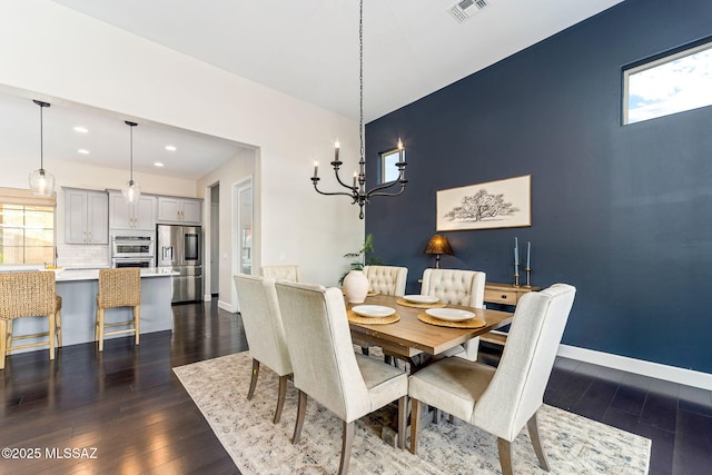 dining room with dark wood-style flooring, a chandelier, visible vents, and recessed lighting