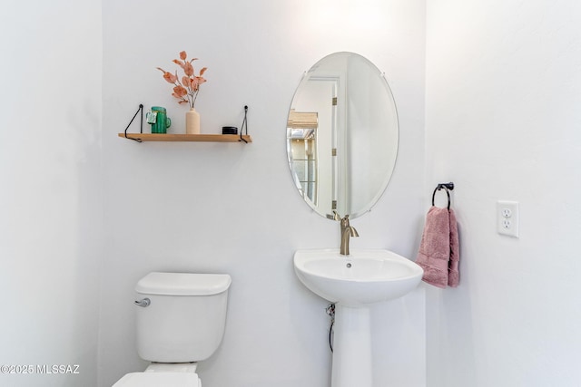 bathroom featuring toilet