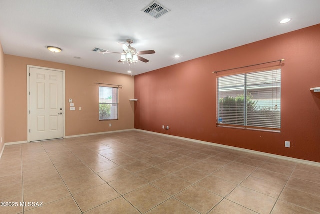empty room with baseboards, recessed lighting, light tile patterned floors, visible vents, and ceiling fan