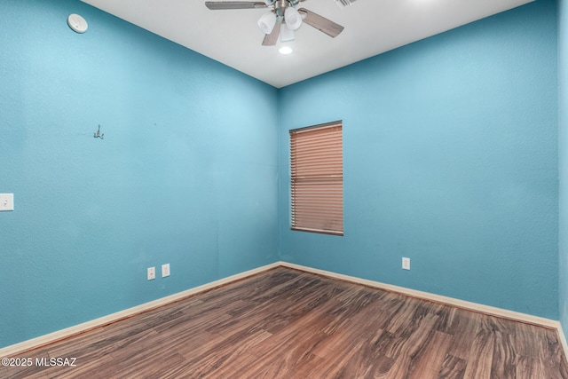 spare room with recessed lighting, ceiling fan, baseboards, and wood finished floors