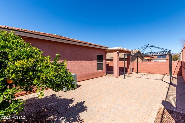 view of patio / terrace with a gazebo and fence