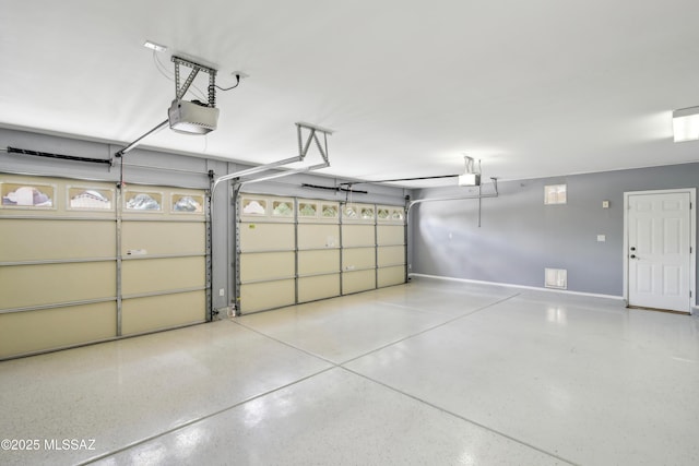 garage featuring baseboards and a garage door opener