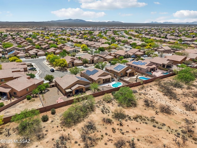 birds eye view of property featuring a mountain view and a residential view