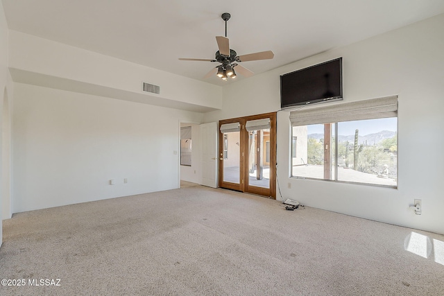 4247 W Flying Diamond Dr, Tucson, AZ 85742 - unfurnished living room featuring a ceiling fan, visible vents, and carpet