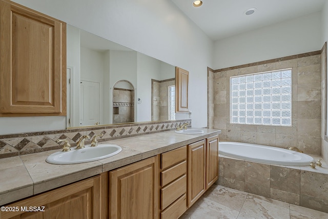 4247 W Flying Diamond Dr, Tucson, AZ 85742 - full bathroom with double vanity, a bath, and a sink