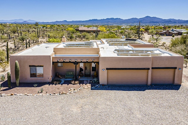 4247 W Flying Diamond Dr, Tucson, AZ 85742 - view of front of property with a chimney, a mountain view, gravel driveway, and stucco siding