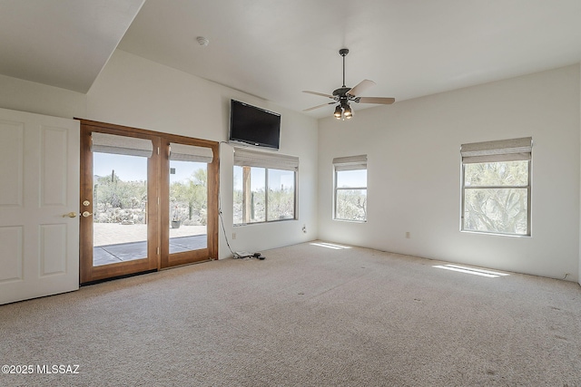 4247 W Flying Diamond Dr, Tucson, AZ 85742 - empty room featuring carpet, a wealth of natural light, and a ceiling fan