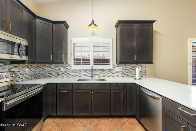 9622 E Paseo, San Ardo, Tucson, AZ 85747 - kitchen with stainless steel appliances, a sink, backsplash, and light countertops