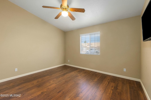 9622 E Paseo, San Ardo, Tucson, AZ 85747 - spare room with dark wood finished floors, baseboards, ceiling fan, and vaulted ceiling