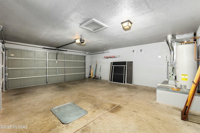 garage featuring water heater and a garage door opener