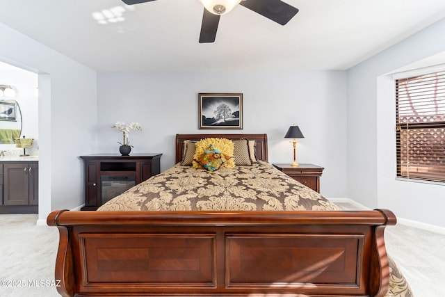 14045 N Desert Butte Dr, Oro Valley, AZ 85755 - bedroom with carpet floors, connected bathroom, baseboards, and a ceiling fan