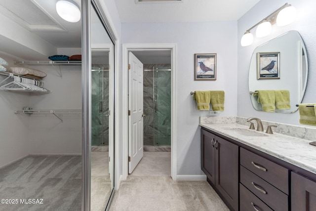14045 N Desert Butte Dr, Oro Valley, AZ 85755 - full bathroom with vanity, baseboards, a shower stall, and a spacious closet