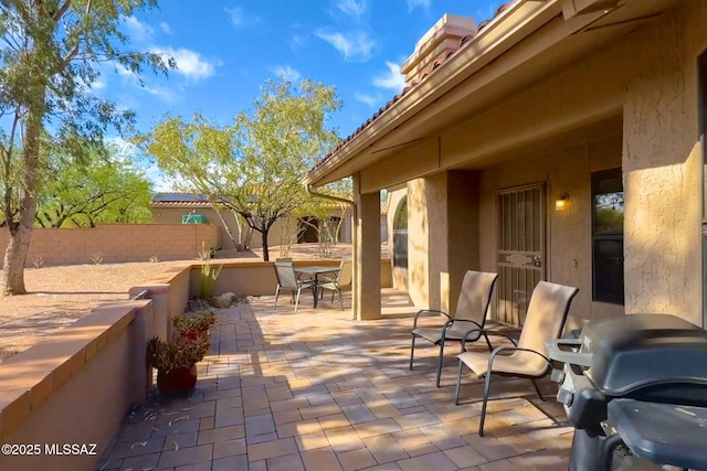 14045 N Desert Butte Dr, Oro Valley, AZ 85755 - view of patio / terrace featuring outdoor dining area, fence, and area for grilling