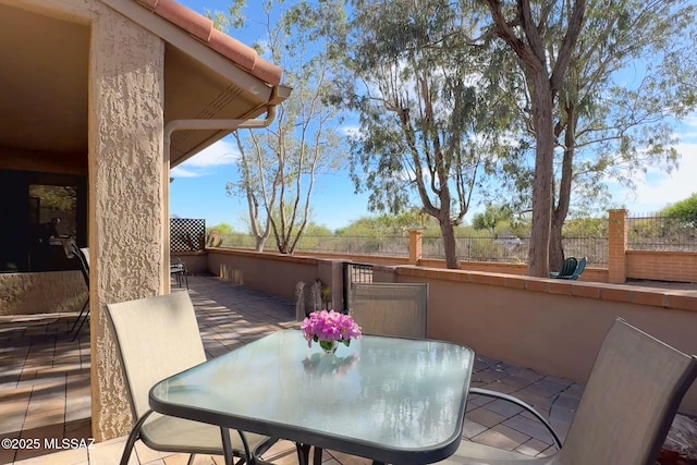 14045 N Desert Butte Dr, Oro Valley, AZ 85755 - view of patio / terrace featuring fence and outdoor dining space