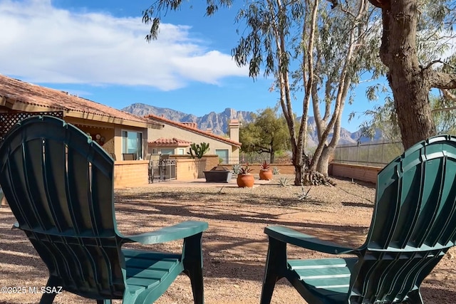 14045 N Desert Butte Dr, Oro Valley, AZ 85755 - view of yard with a mountain view and fence