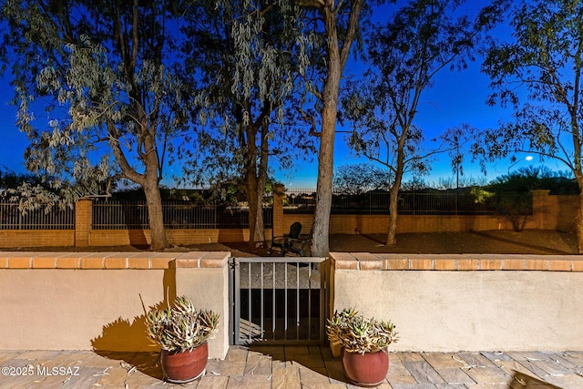 14045 N Desert Butte Dr, Oro Valley, AZ 85755 - view of patio featuring fence private yard and a gate