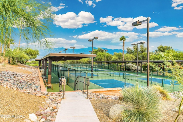 14045 N Desert Butte Dr, Oro Valley, AZ 85755 - view of sport court with fence and a mountain view