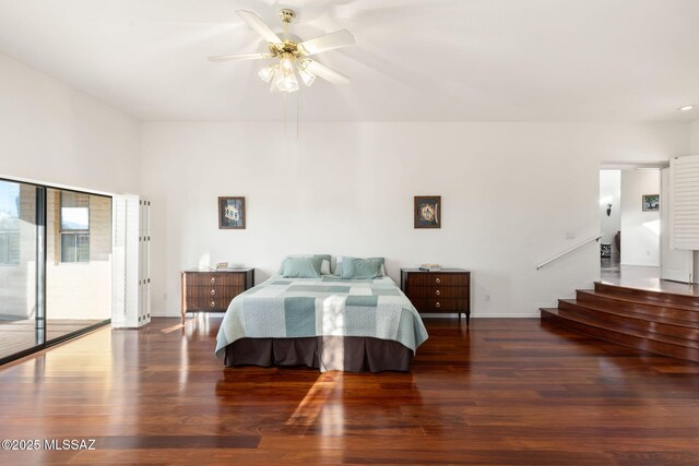 bedroom with baseboards, wood finished floors, ceiling fan, and access to exterior