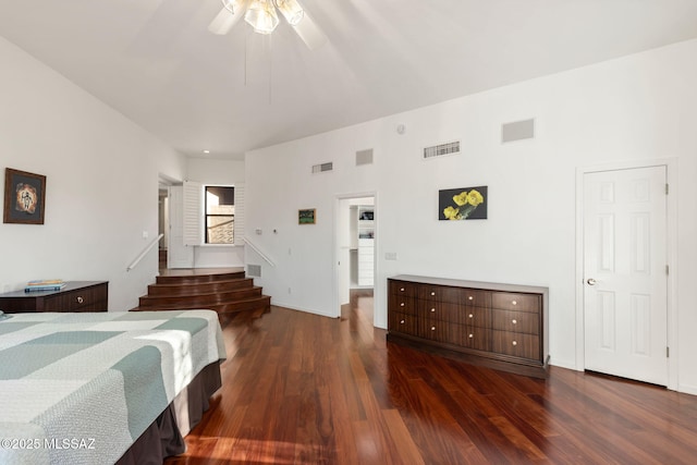 bedroom featuring visible vents, ceiling fan, and dark wood-style flooring