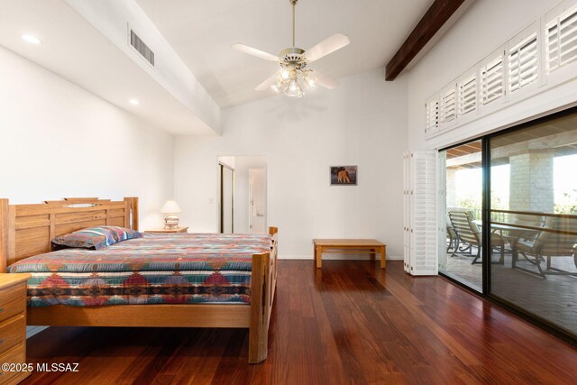 bedroom with wood finished floors, a towering ceiling, baseboards, access to outside, and visible vents