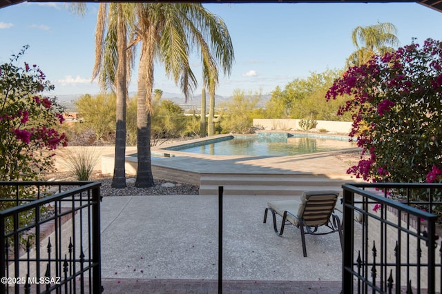 outdoor pool featuring a patio