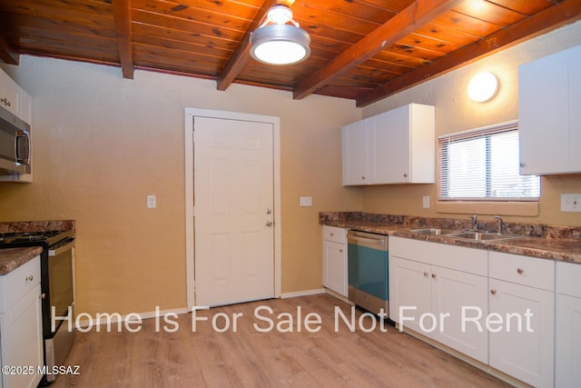 kitchen with wood ceiling, appliances with stainless steel finishes, beamed ceiling, and a sink
